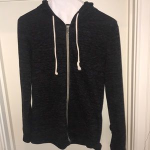 zip up hoodie with pockets and a drawstring